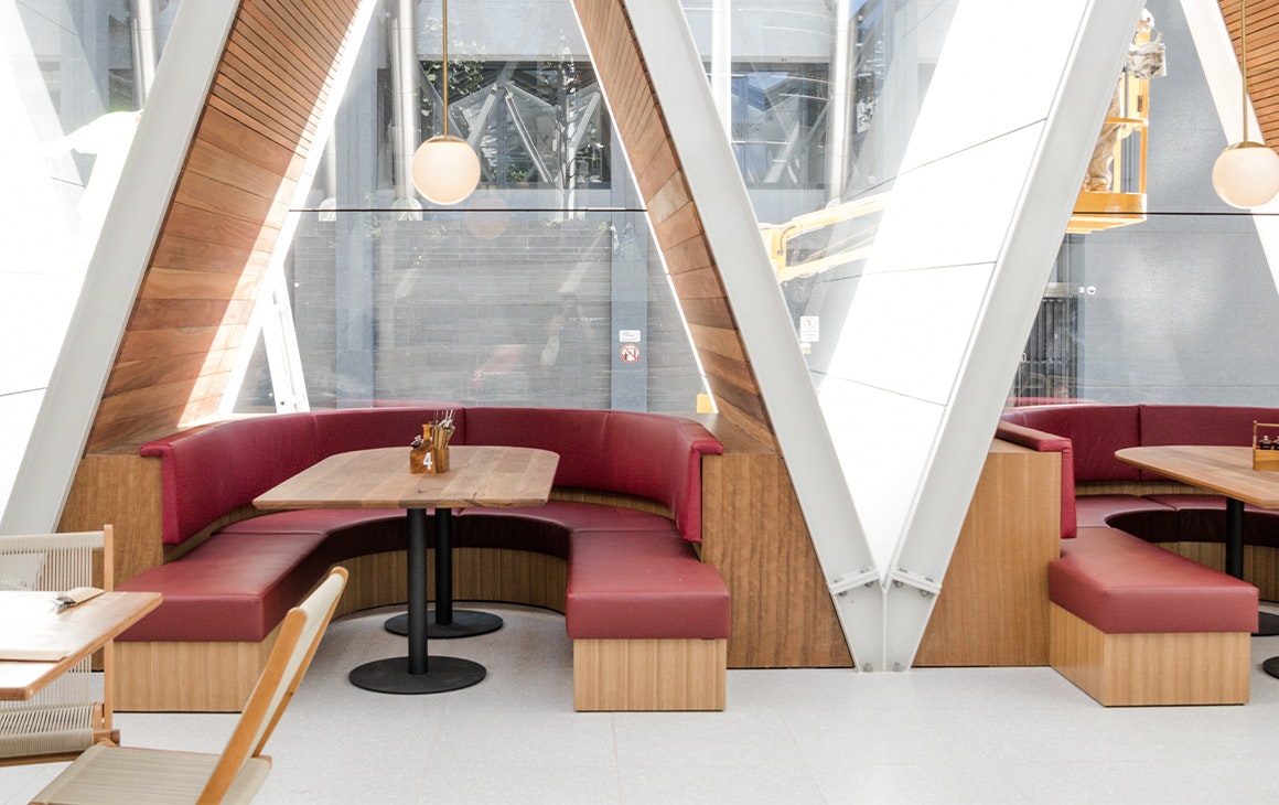 booths underneath a frame style structures